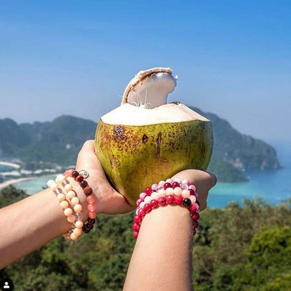 Taste Nirvana Coconut Water glass with ice implies refreshing, thirst-quenching experience.