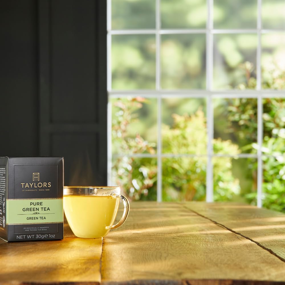 Chilled glass of iced Taylors green tea with lemon slice.