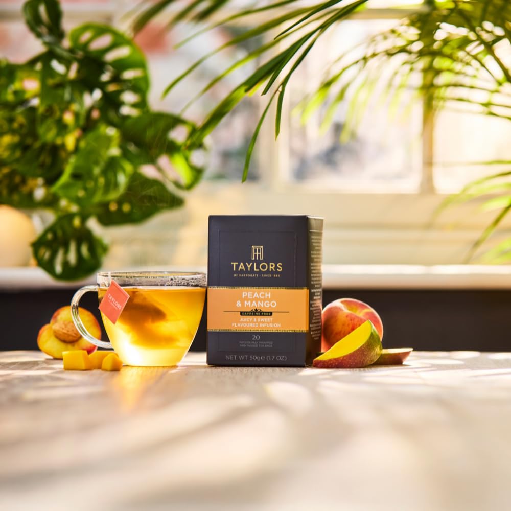 Steeping Taylors of Harrogate Peach & Mango tea bag in hot water for a flavorful cup