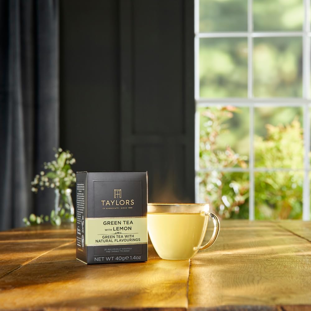 Taylors of Harrogate green tea with lemon in a cozy kitchen scene for tea time.