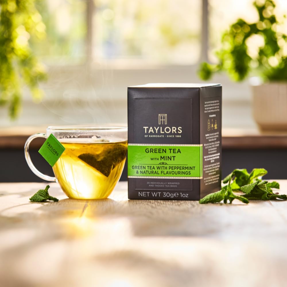 Taylors of Harrogate Green Tea with Mint cup with lemon ready to sip.