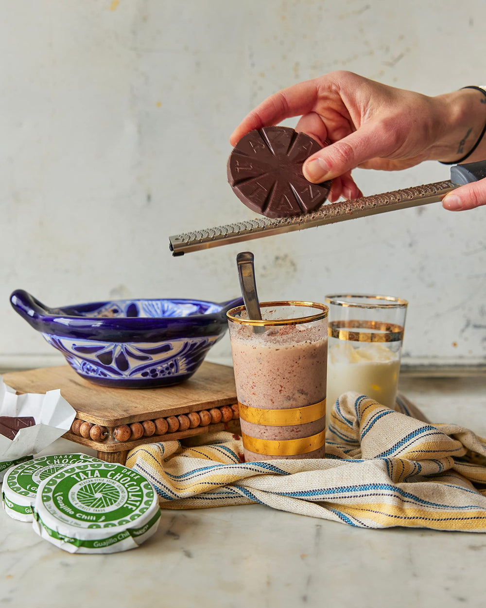 Taza Mexicano discs on wood background for artisanal vibe