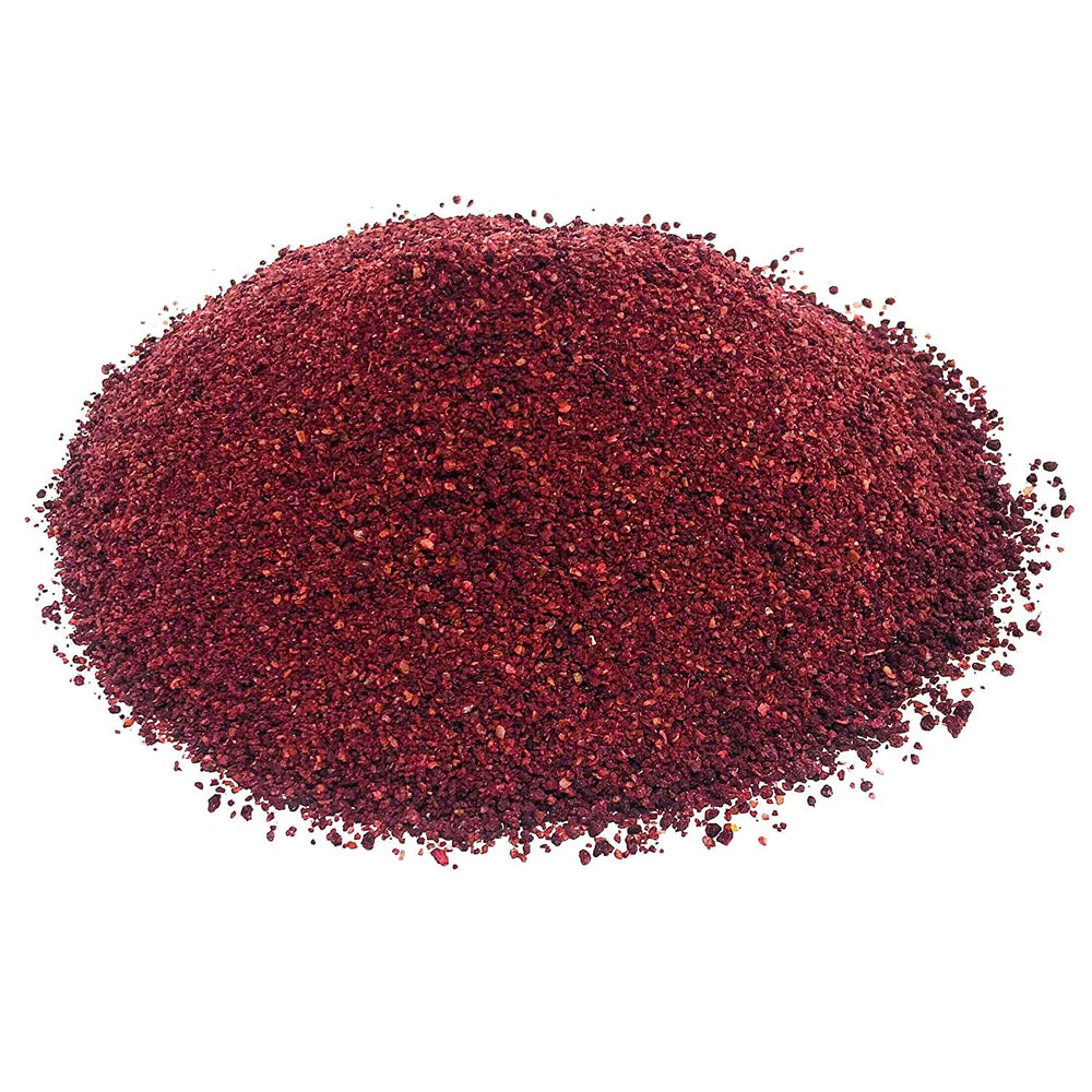 Busy kitchen scene showcasing Tazah Sumac Spice as a versatile pantry staple.
