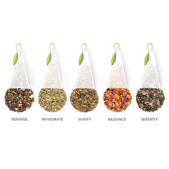 Tea Forte Invigorate pyramid tea bag close-up, energizing morning ritual.