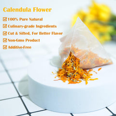 TEARELAE brewed calendula cup, warm amber tea inviting relaxing moments.