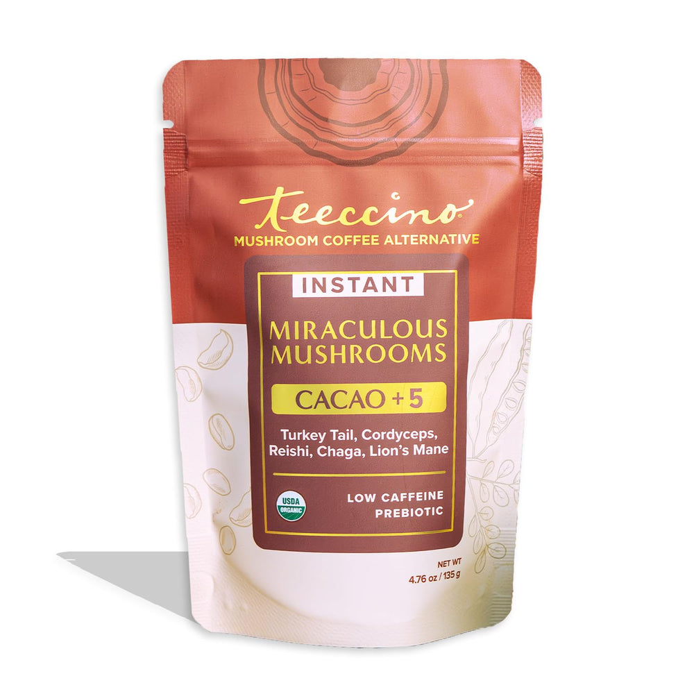 Teeccino Miraculous Mushrooms Instant Cacao being poured into a mug for a caffeine-free indulgence