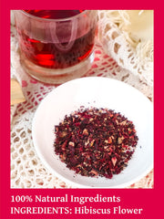 TeeLux hibiscus tea bags in iced glass reveal vibrant red brew.