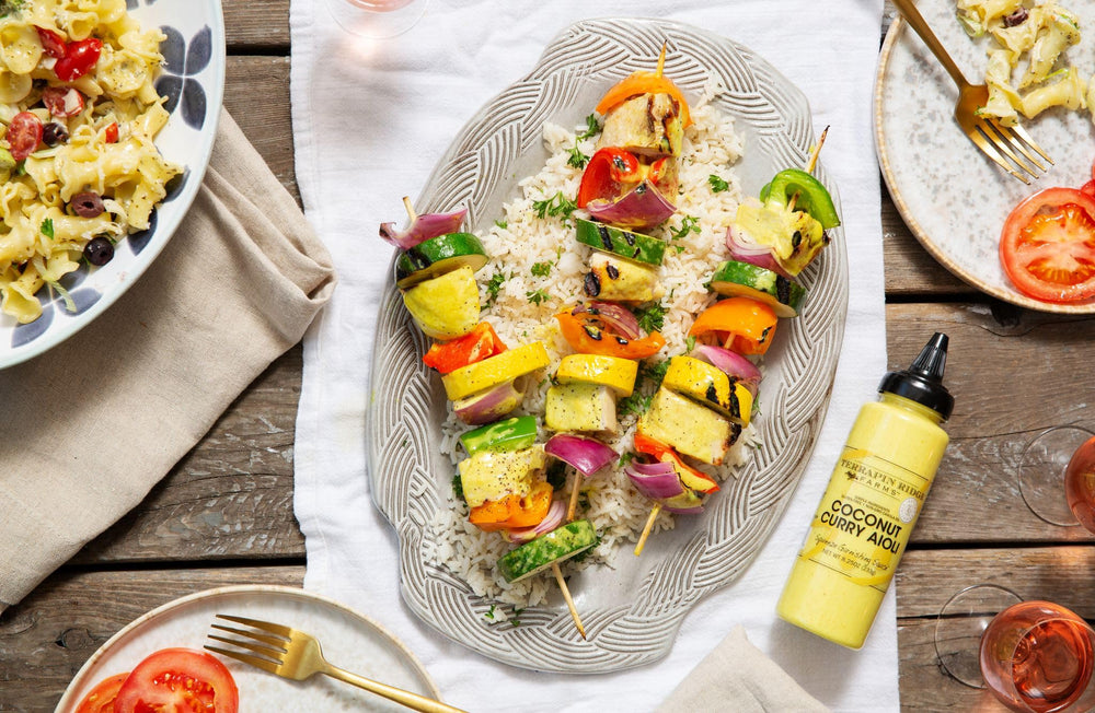Creamy coconut curry aioli atop plated chicken from Terrapin Ridge Farms