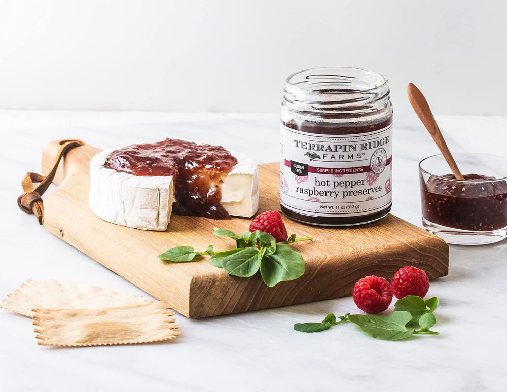Terrapin Ridge preserves on a cheese board, suggesting snack-ready pairing