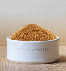 Terrasoul Coconut Sugar pouring into coffee, adds subtle caramel sweetness.