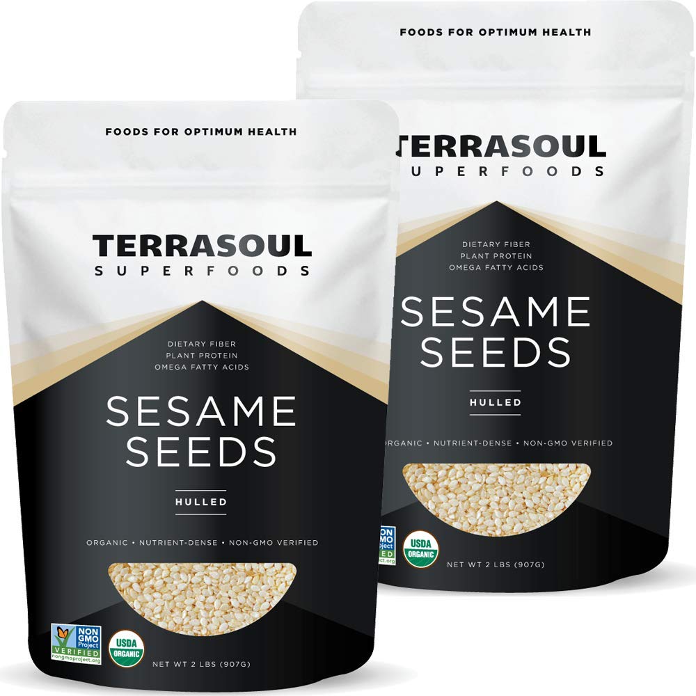Terrasoul Organic hulled sesame seeds pour into a bowl for tahini or baking