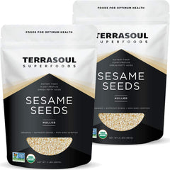 Terrasoul Organic hulled sesame seeds pour into a bowl for tahini or baking
