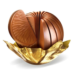 Terry's Milk Chocolate Oranges being tapped to separate segments for easy sharing