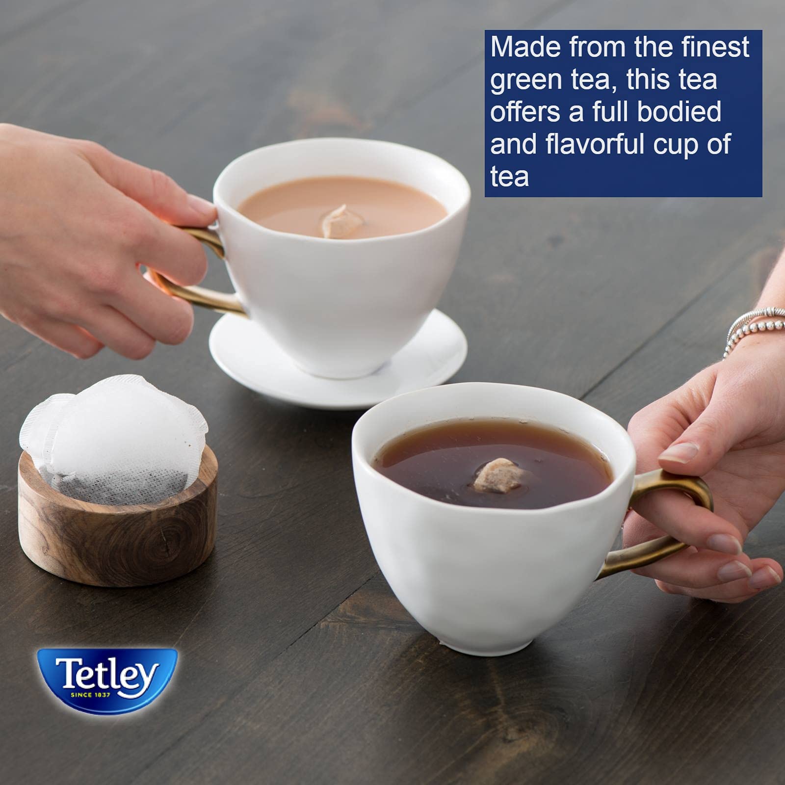 Pouring Tetley tea over ice for a refreshing iced tea