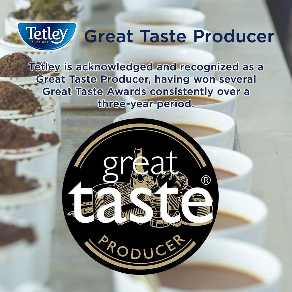 Tetley Decaf Tea Bags 80ct steaming mug with book for cozy evenings.