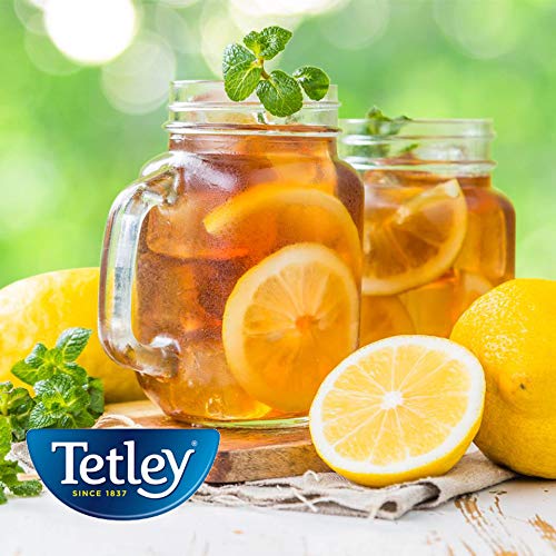 Tetley tea bag pouring into glass demonstrates a quick, flavorful brew.