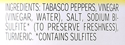 Texas Pete Green Pepper Sauce being poured to flavor seafood.