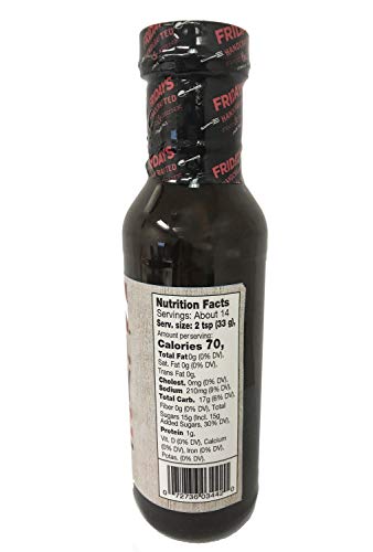 Six-pack display of T.G.I. Fridays Signature Whiskey Sauce bottles for family meals.