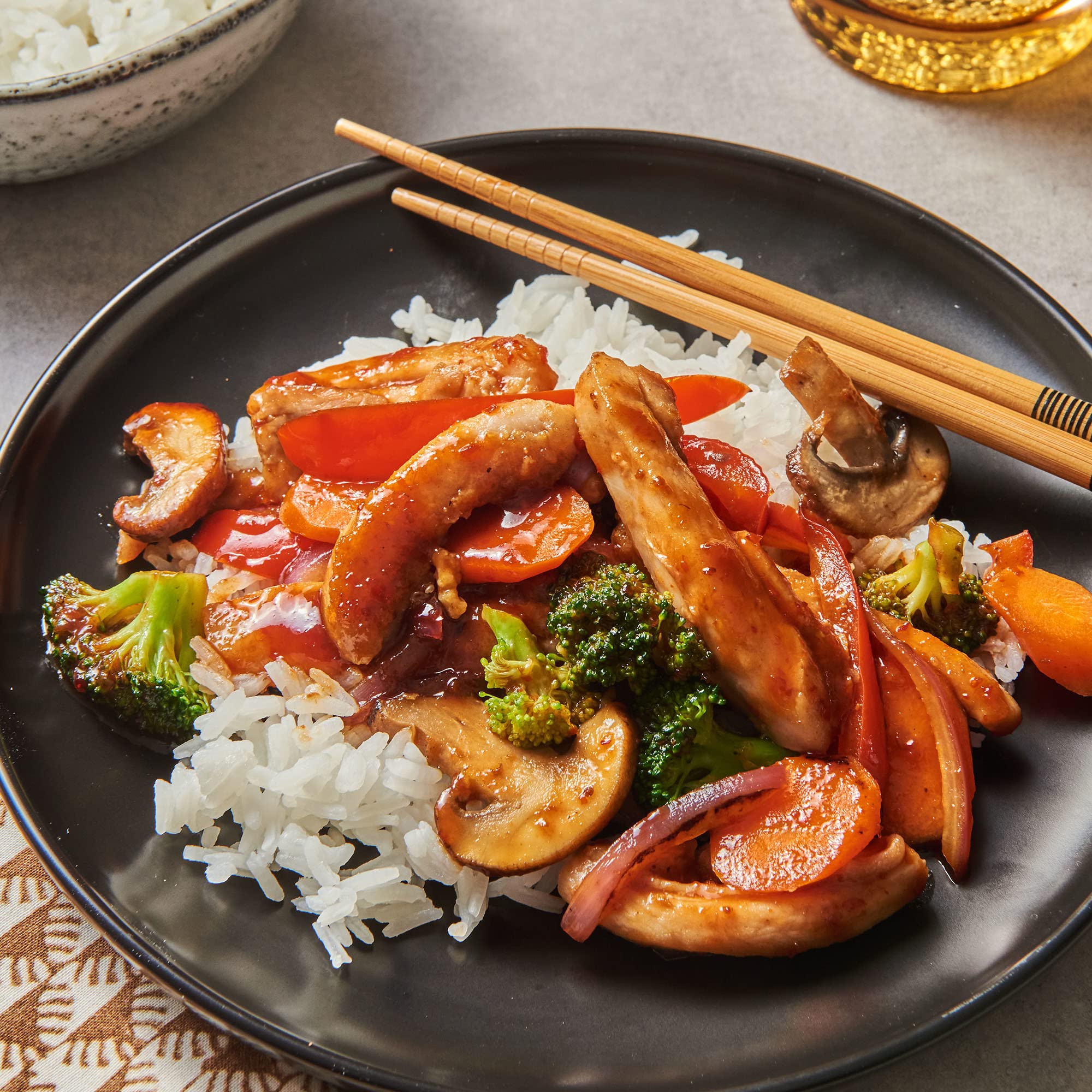 Bottle shown beside vegetables ready to start a quick stir-fry base.