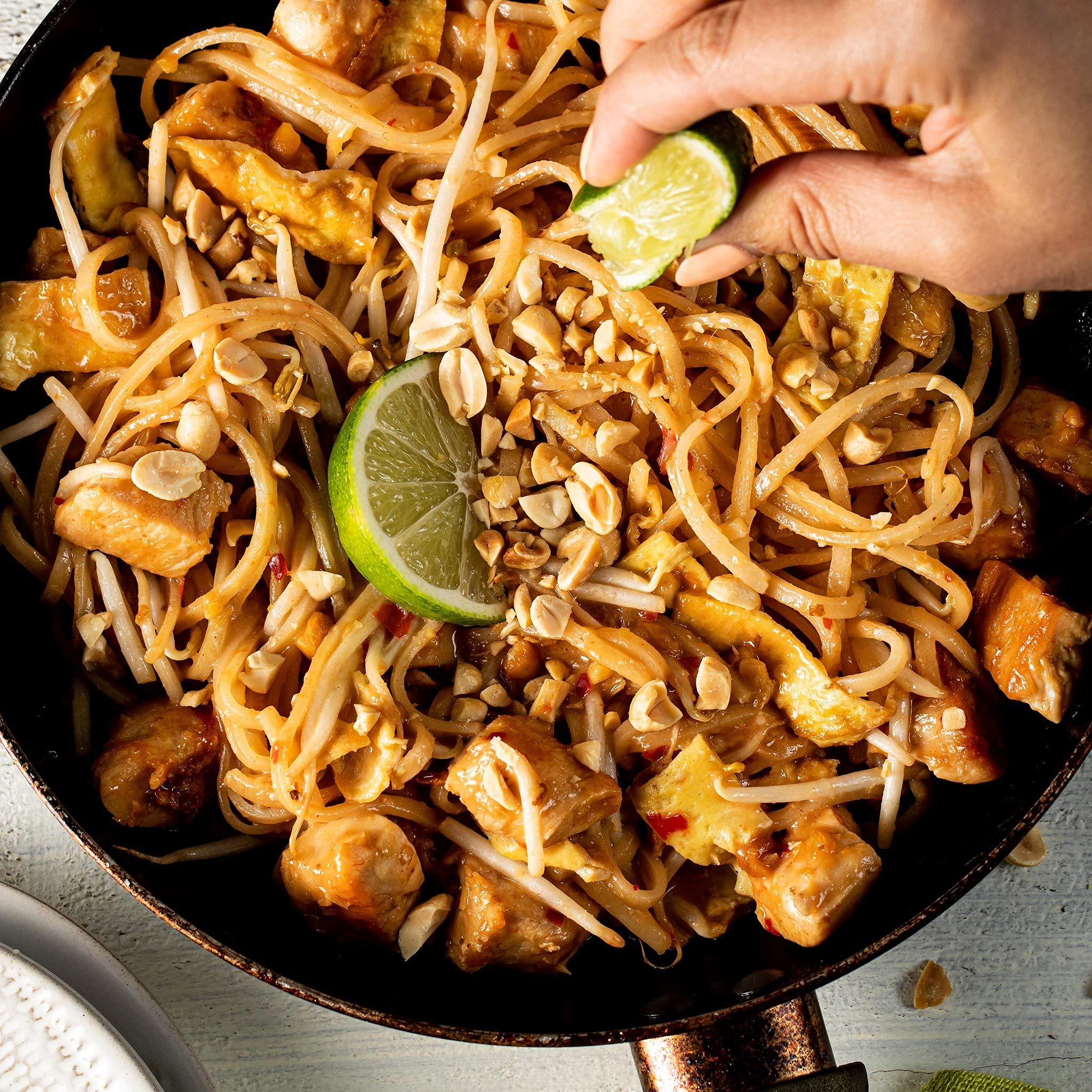 Thai Kitchen stir-fry with veggies, highlighting quick, customizable meals.