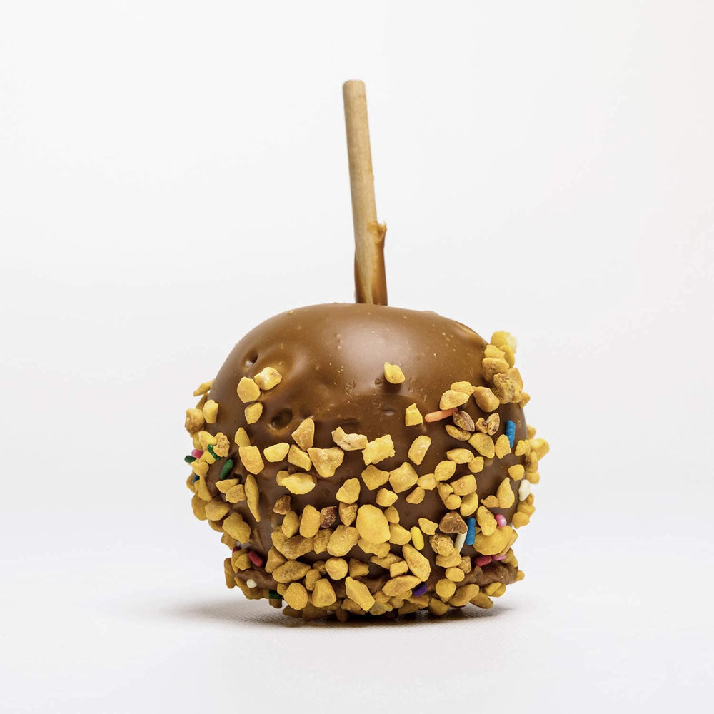 The Bulk-Priced Food Shoppe Peanut Brittle Crunch Coat rainbow sprinkles brighten desserts.