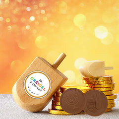 The Dreidel Company dreidel embossed coins ready for festive celebrations.