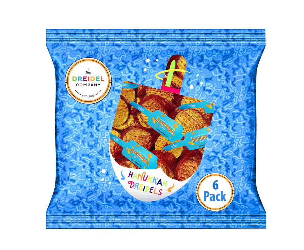 Milk chocolate gelt coins closeup highlighting smooth texture for tasty treats.