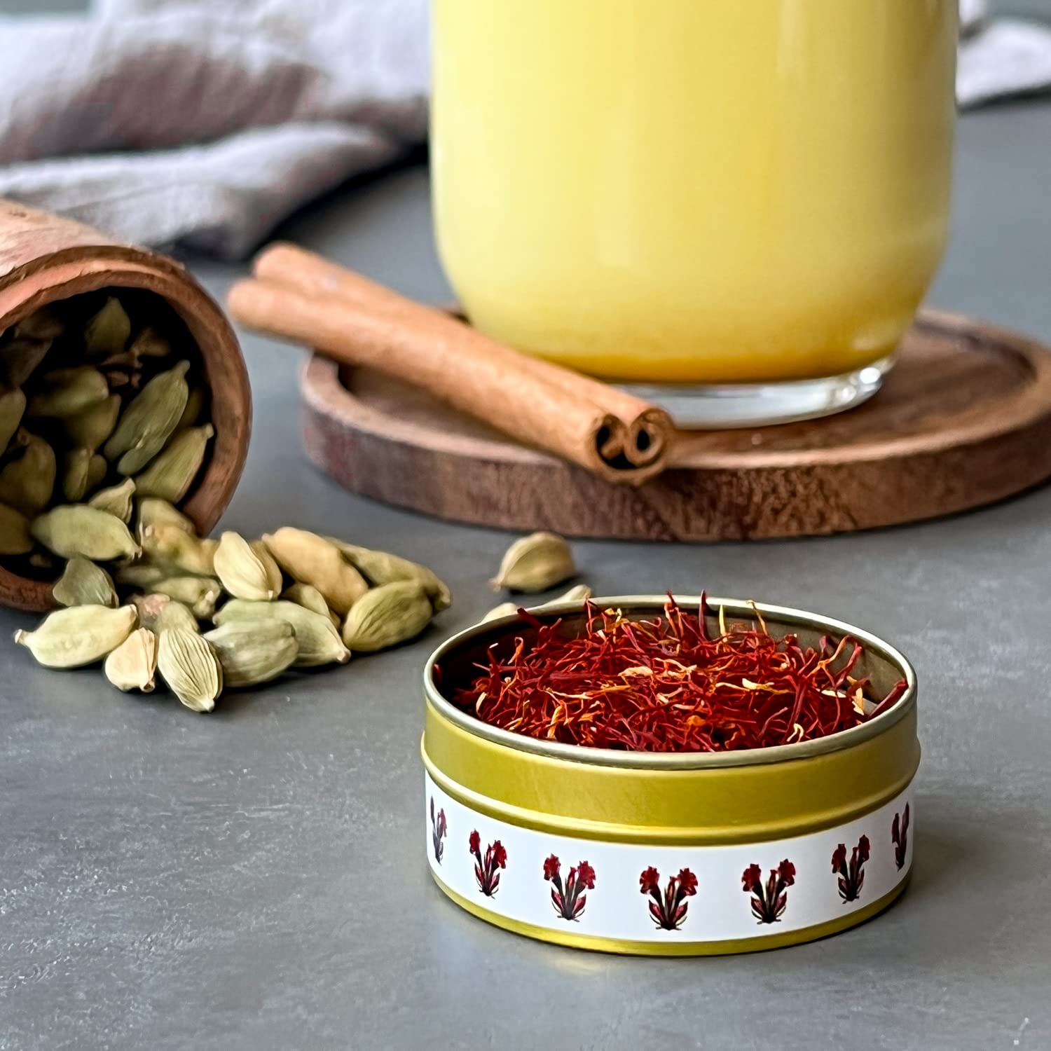 The Gathering of Saffron jar in kitchen-ready setup invites easy culinary use.
