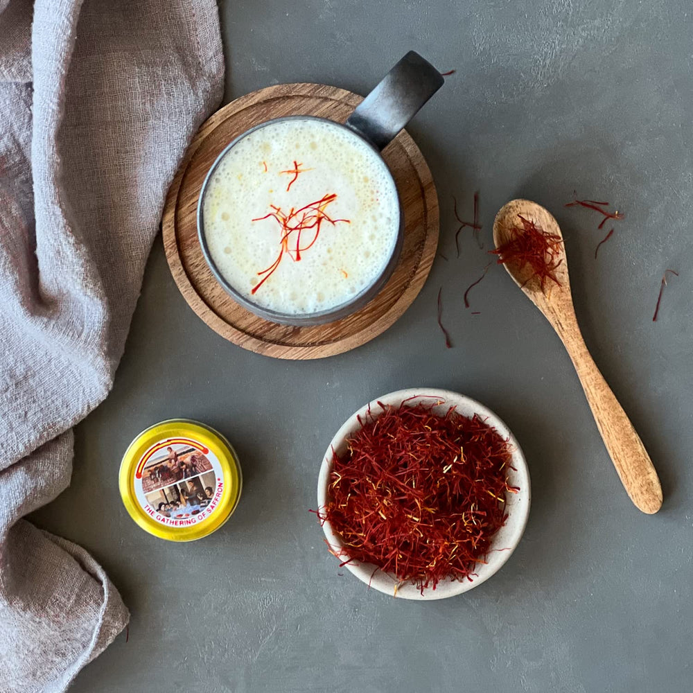 The Gathering of Saffron threads on a dish emphasizes bright color and flavor.