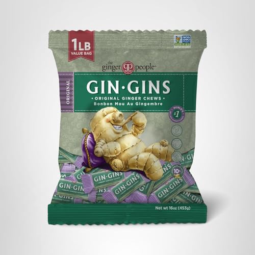 Fresh ginger piece beside Gin Gins chews illustrating ginger-forward flavor.