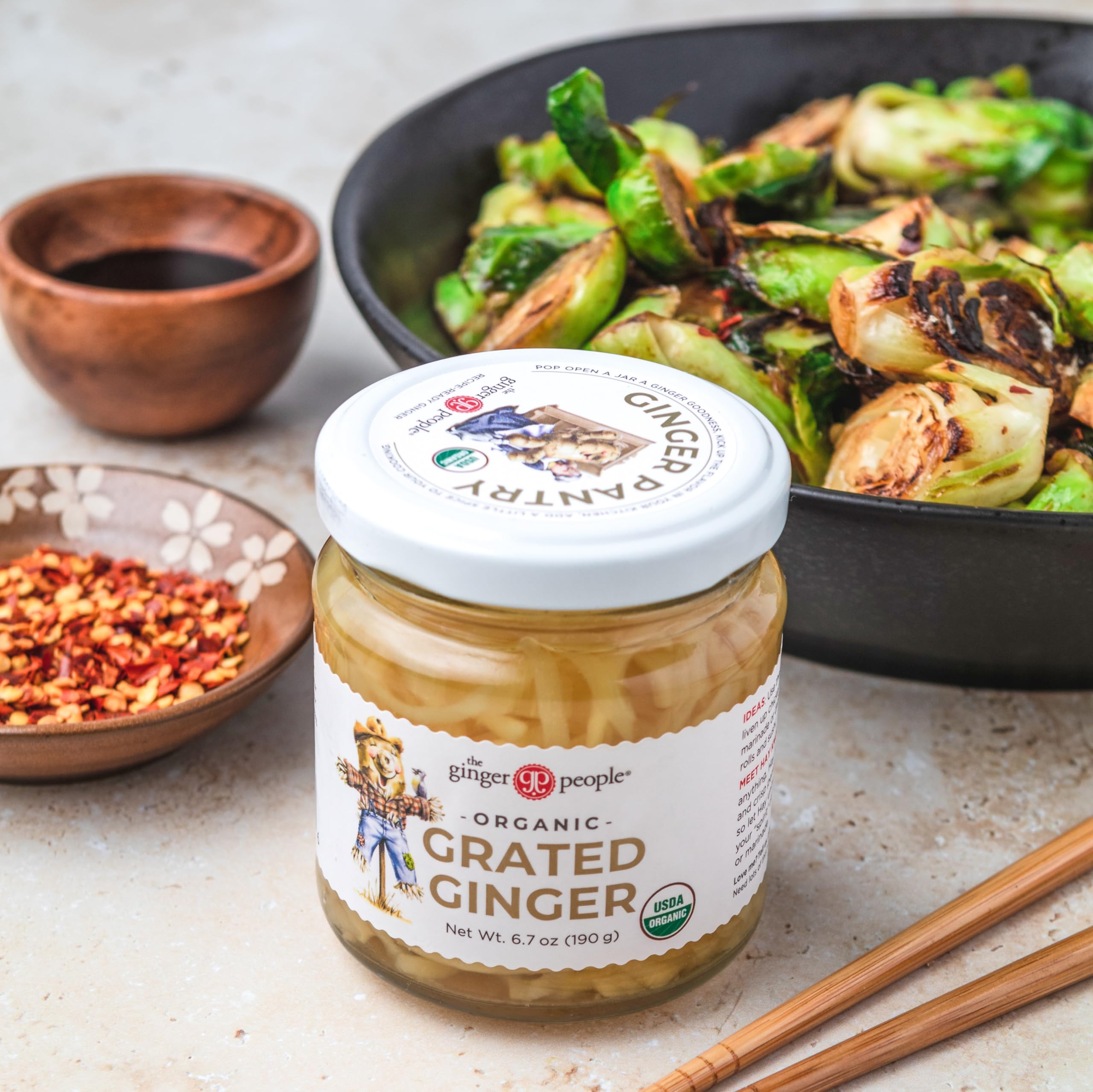 The Ginger People organic grated ginger in brine image highlights ready-to-use ingredients for menus.