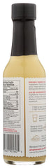 Pouring The Ginger People Organic Ginger Juice into tea for an easy flavor boost.