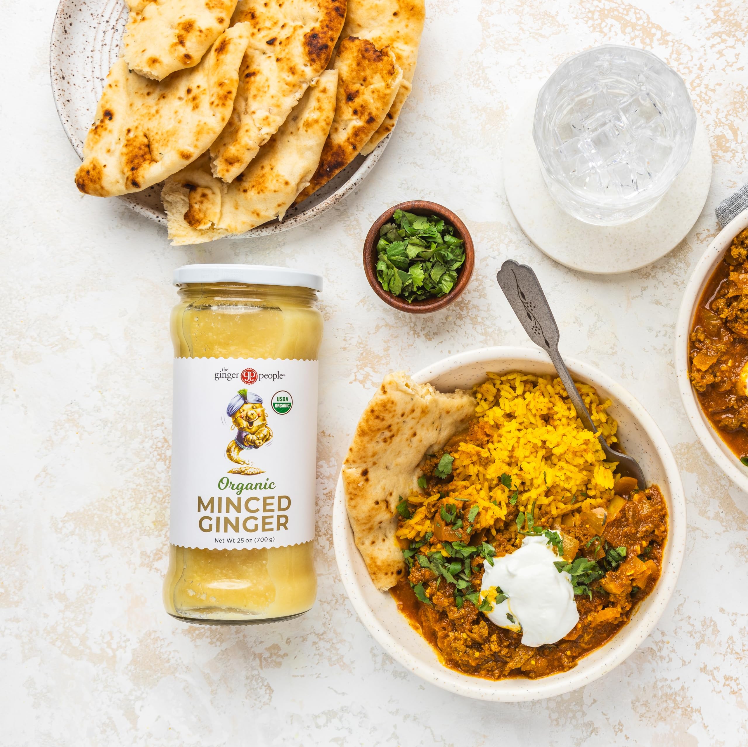 The Ginger People organic minced ginger close-up reveals fresh texture for flavorful marinades