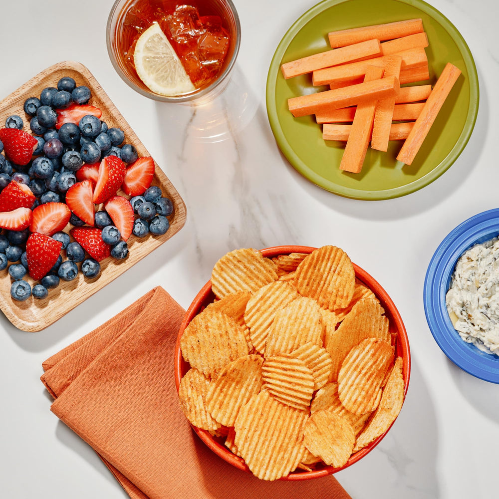 The Good Crisp Company crinkle-cut Outback BBQ chips with smoky flavor and zesty finish.