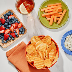 The Good Crisp Company crinkle-cut Outback BBQ chips with smoky flavor and zesty finish.