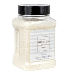 The Hampton Candy Co white sanding sugar sprinkles in a jar for cake decorating.