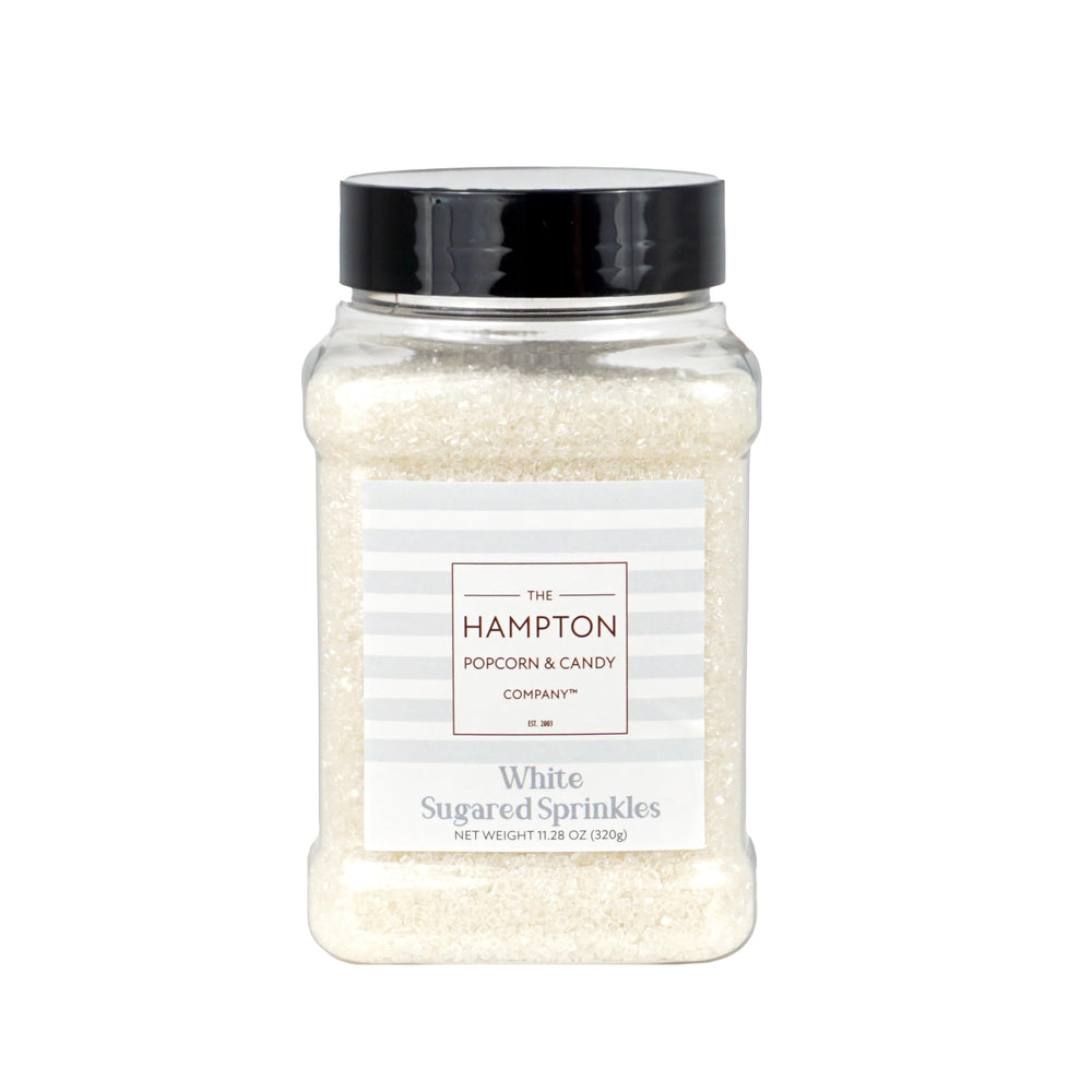The Hampton Candy Co white sanding sugar sprinkles on ice cream for playful toppings.