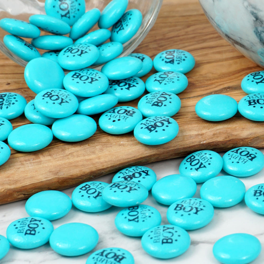 The Hampton Candy Company baby shower table with blue gum buttons centerpiece