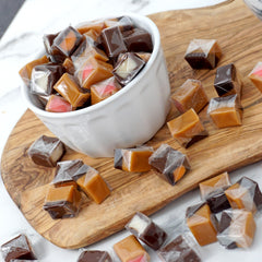 The Hampton Candy Company chocolate caramel orange filling squares, bright citrus twist.