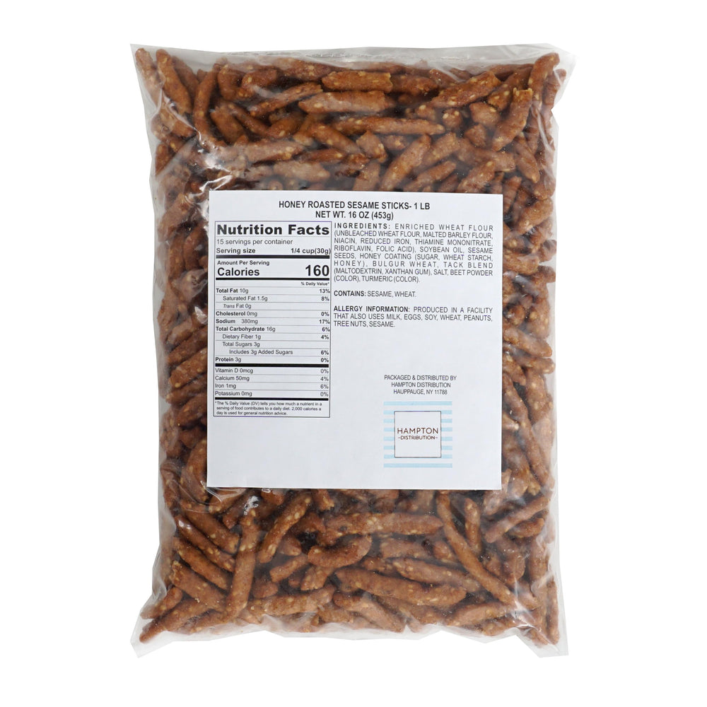 Closeup of honey roasted sesame sticks reveals crisp texture and glossy glaze.