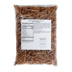 Closeup of honey roasted sesame sticks reveals crisp texture and glossy glaze.