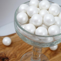 The Hampton Candy Company 2 lb bag of White Shimmer Gumballs adds sparkle to birthdays and gatherings.