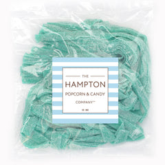 Closeup of Green Apple Sour Belts from The Hampton, showing glossy green ribbons.