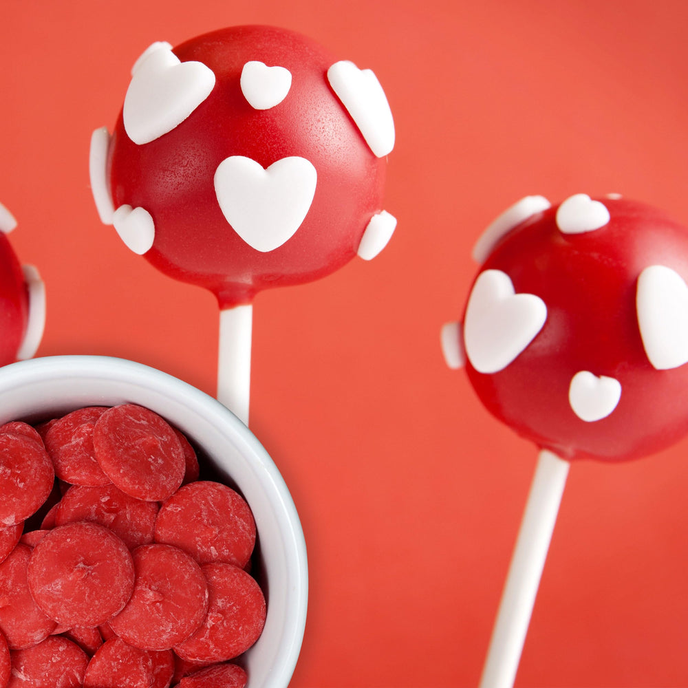 Sundae topping or drizzle: Red Chocolate Wafers coating popcorn with shimmer.