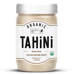 The Holly Tree Organic Tahini Paste bottle shows a smooth, creamy sesame base for dressings.