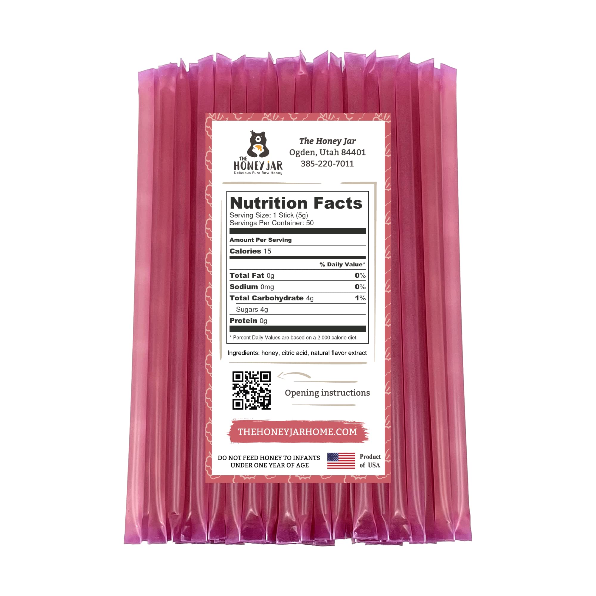 The Honey Jar Raspberry honey stick beside coffee for quick natural sweetness.