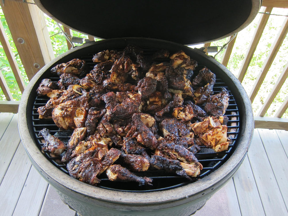 The Jerk Man seasoning on chicken before grilling.