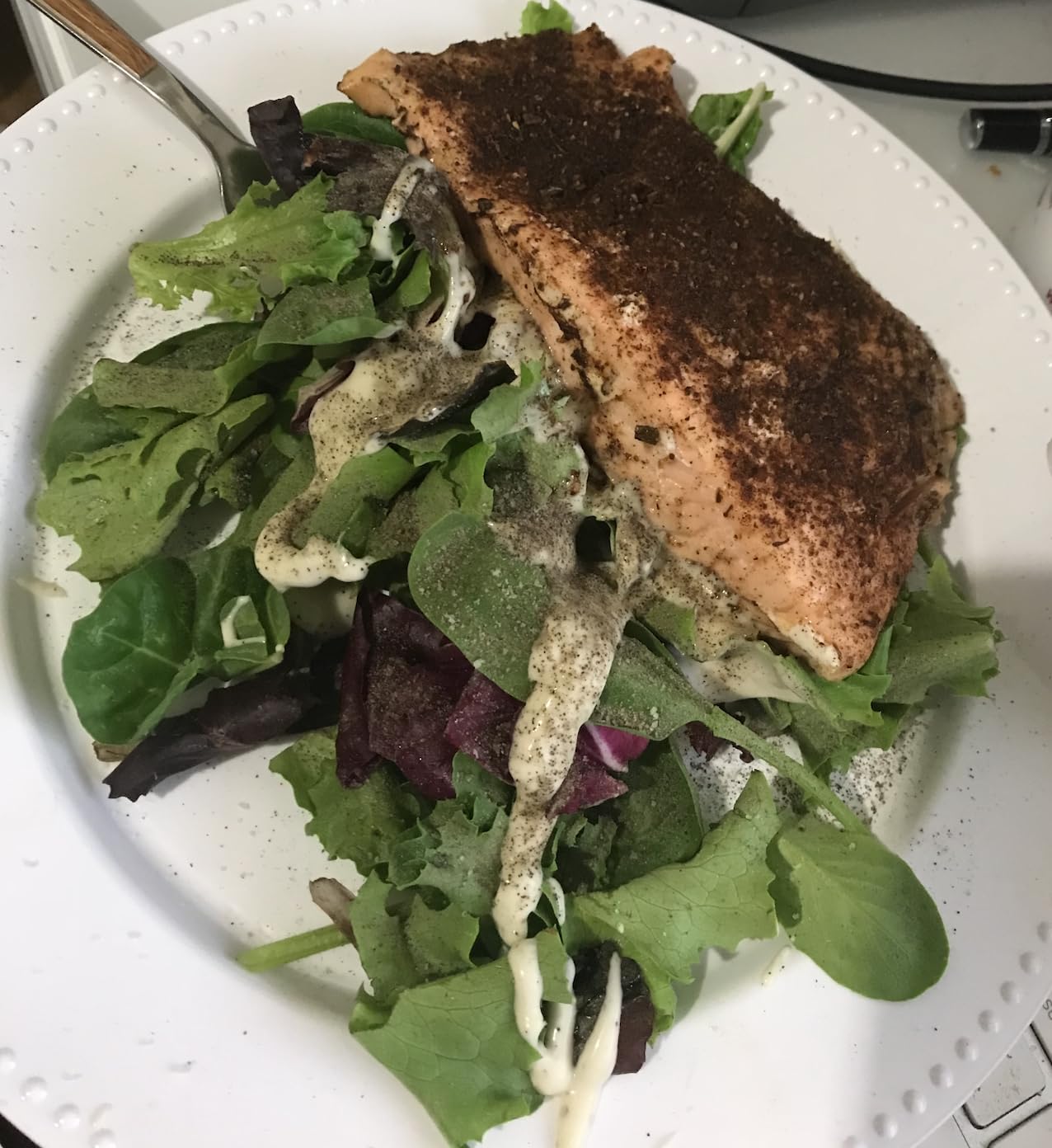 The Jerk Man seasoning on a grilled chicken piece.