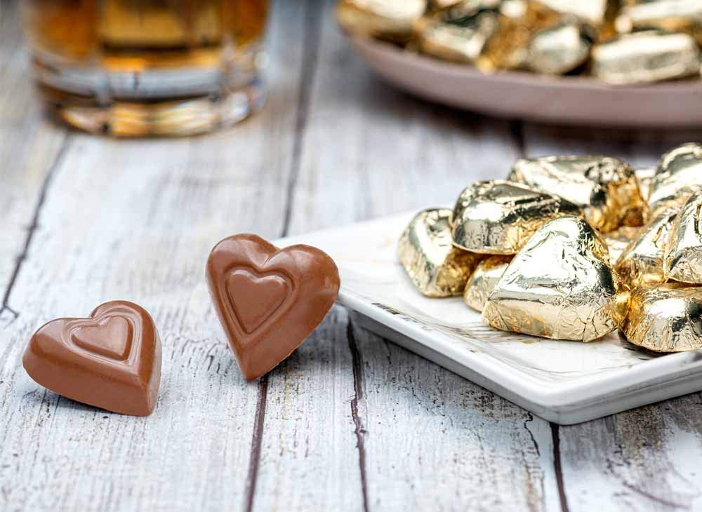 Close-up of Madelaine milk chocolate gold hearts in foil