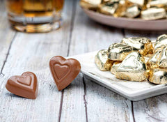 Close-up of Madelaine milk chocolate gold hearts in foil
